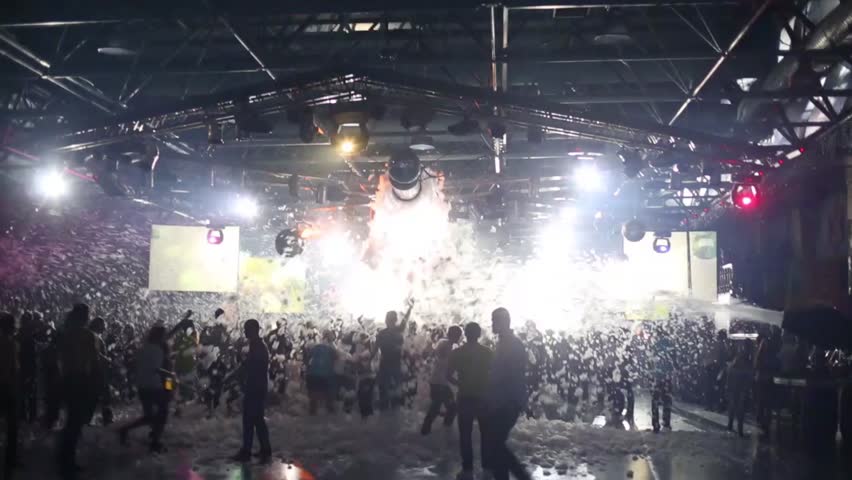 MOSCOW, RUSSIA - DEC 21, 2013: Foam falls on people dancing at a party in a nightclub | Shutterstock HD Video #9138566