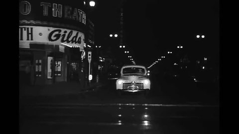 CIRCA 1940s - Downtown L.A. at night in 1946 (part 2).