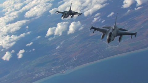 CIRCA 2010s - Two F-16 fighter jets fly in formation.