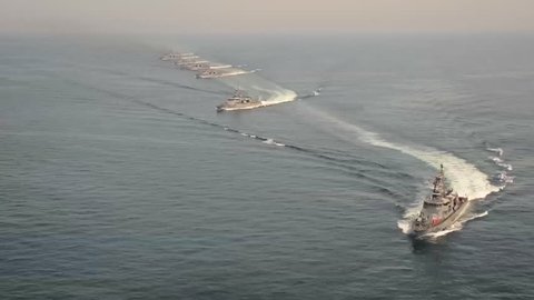 CIRCA 2010s - Aerial of U.S. Navy frigates and destroyers sail in a fleet.