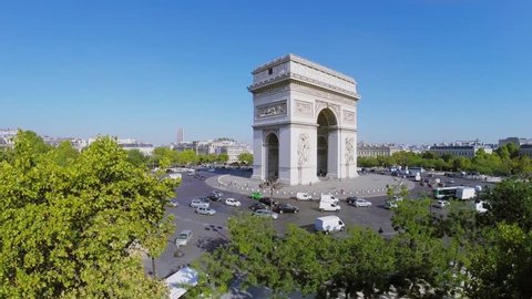 PARIS - SEP 12, 2014: Transport traffic on Place Charles de Gaulle with Arc de Triomphe at autumn sunny day. Aerial view. Arc is 50 meters high.