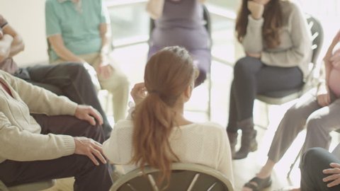 4K People in group therapy session talk about their problems together