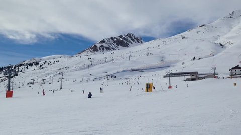 Mountain with ski lift and skier