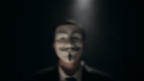 Anonymous hacker activist on black background