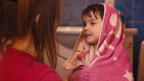 Mom Wipes Her Girl in a bathroom. Shot in RAW. Color Correction in Davinci Resolve.