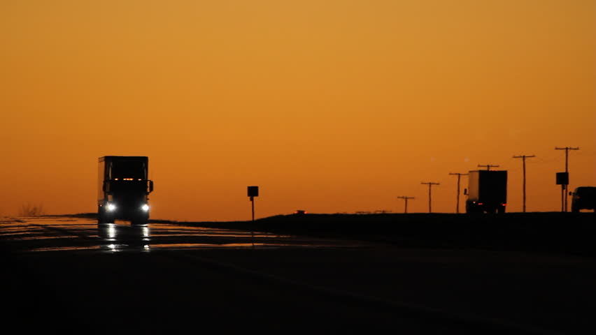 Oncoming truck with headlights at dusk. Saskatchewan, Canada.  Royalty-Free Stock Footage #9159587