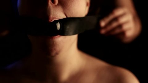 master deploys gagged submissive young girl / bdsm theme