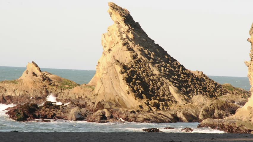 This is a large sea rock on the Oregon coast. This is a very steep cliff.