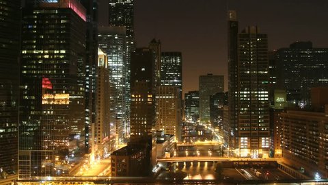 Time lapse Chicago Skyline at night. All trademarks are blurred.  