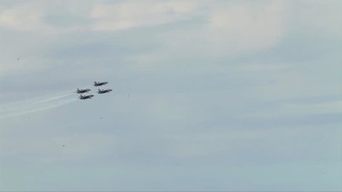 CIRCA 2010s - The Blue Angels fly in formation at an airshow.