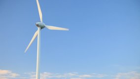 Wind turbine in front of bright blue sky