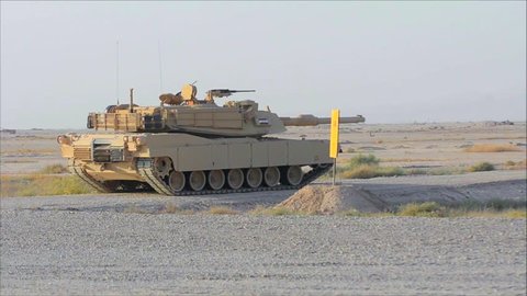 CIRCA 2010s - Abrams tanks fires during the Iraq War.