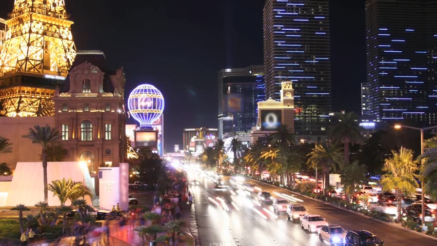 Time lapse Las Vegas Strip at night. All trademarks are blurred. License plates and faces cannot be identified.