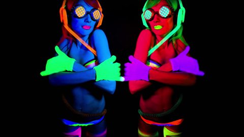 4k shot of sexy female disco dancer in UV fluorescent costume
