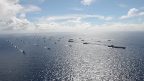 CIRCA 2010s - Aerial of massive flotilla of Navy ships on the move across the Pacific.