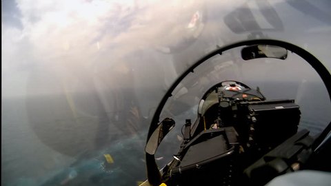 CIRCA 2010s - POV shot of a fighter jet landing on an aircraft carrier.