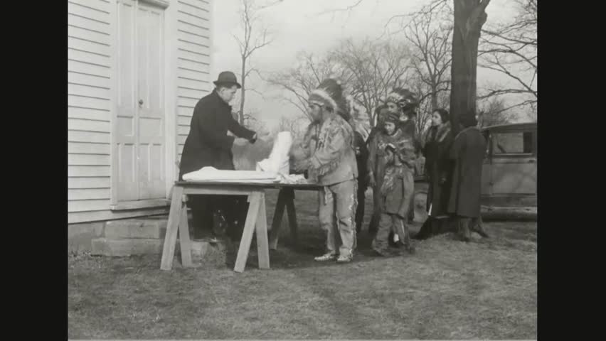 CIRCA 1930s - Native Americans receive blankets during the winter of 1937 in New York.