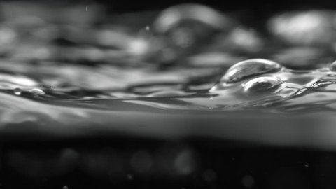 Camera follows water bubbles risingd on surface. Shot with high speed camera, phantom flex 4K. Slow Motion. Unedited version is included at the end of clip.