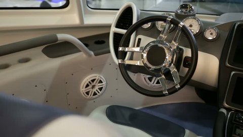 MOSCOW, RUSSIA - MARCH 10, 2015: Steering wheel of luxury motorboat. International boats and yachts exhibition, "Moskovskoe Boat Show" in Crocus expo pavillion.