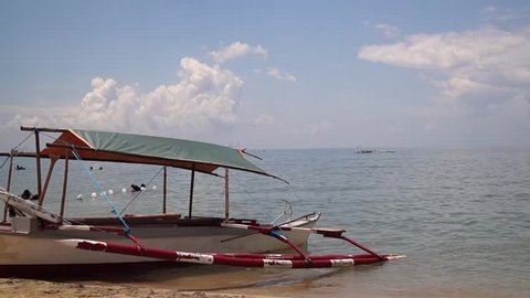 SAN JUAN, BATANGAS, PHILIPPINES - APRIL 28, 2013: parked leissure boat boatalong white sandy beach illustrative editorial