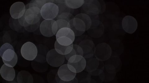 diffuse bright bokeh circles against a dark background