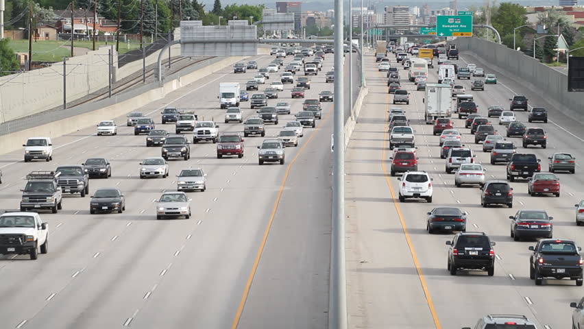 Crowded morning traffic in Denver, Colorado, with slow pan down. HD 1080p.