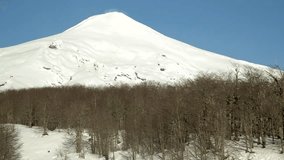 Vila Rica Volcano one of Chile's most active volcanoes. Villarrica is popular for climbing with guided hikes to the crater. Nice day time video,.
