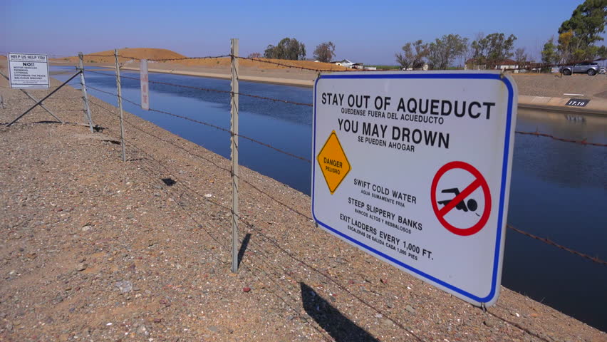 CALIFORNIA - CIRCA 2014 - Signs warn people to stay out of the California aqueduct.