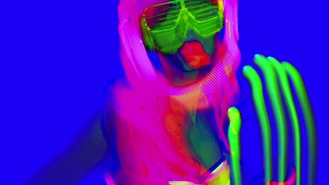 sexy female disco dancer poses in UV costume

