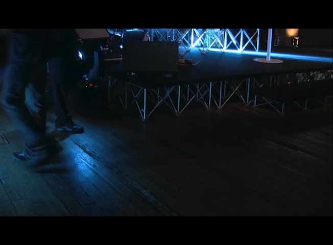 People walking in front of the stage