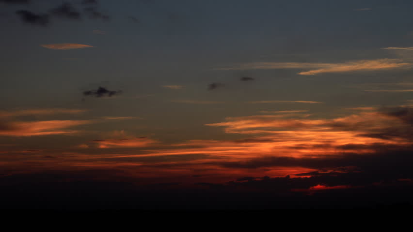 Fiery red sunset with a plethora of interesting clouds. HD 1080p timelapse.