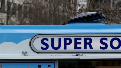 Super soft ice bus in London. It is a white big bus selling ice cream