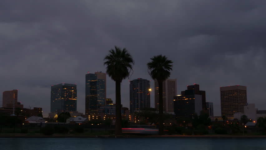 Cloudy skies before sunrise over the Phoenix Arizona skyline. 4K UHD time lapse.