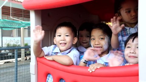 BANGKOK, THAILAND -  FEB 9, 2015: Unknown children in Children playing in the playground at Kindergarten School. Pieamsuwan school in bangkok at 2015, Children are happy.