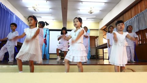 BANGKOK, THAILAND -  FEB 9, 2015: Unknown children, kindergarten Students aerobics in the morning at Kindergarten School. Pieamsuwan school in bangkok at 2015, Children are happy.