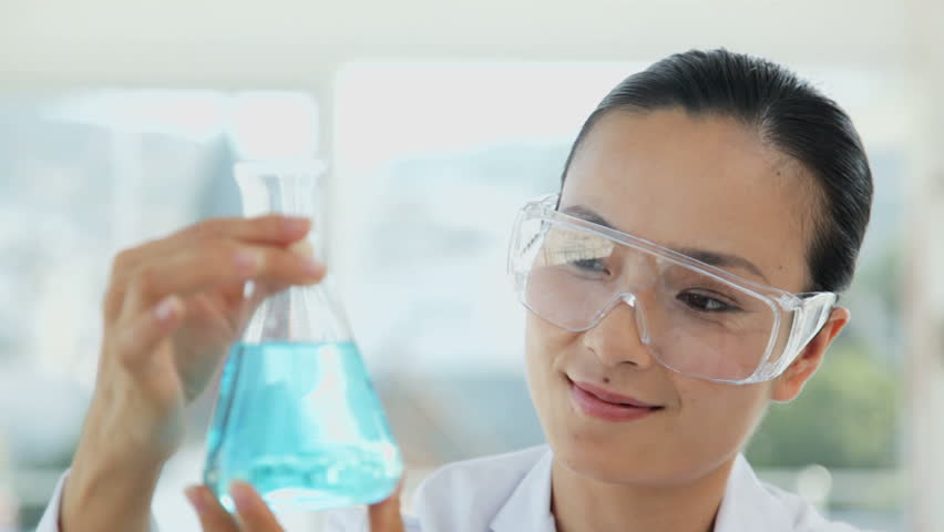 Female Researcher Holding a Flask | Shutterstock HD Video #926812