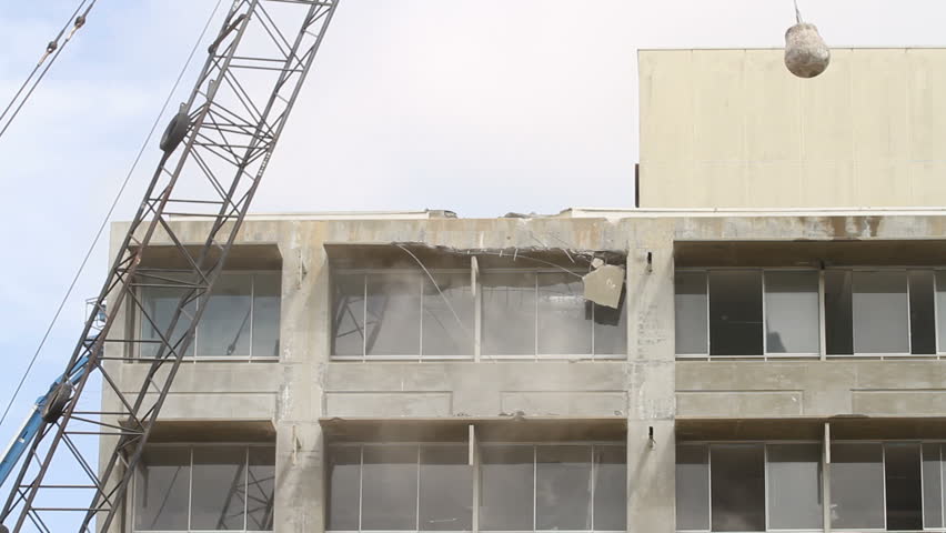 Building being demolished with a wrecking ball. Shot in Moreno Valley, California in March of 2011.