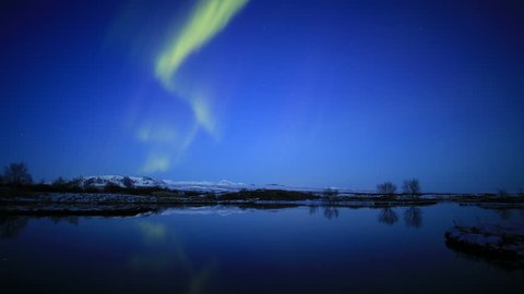 Aurora borealis northern lights calm lake mirror reflection, Iceland 4k