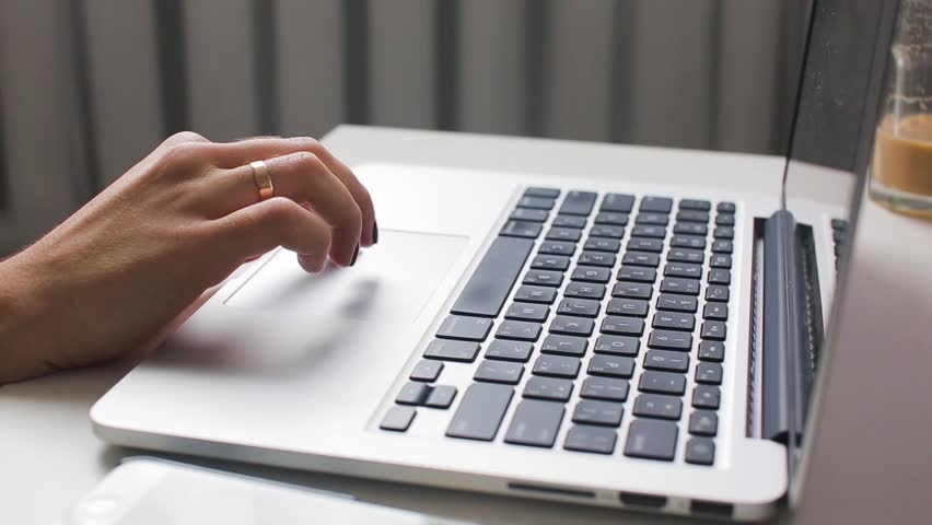 Girl types and search information with a laptop