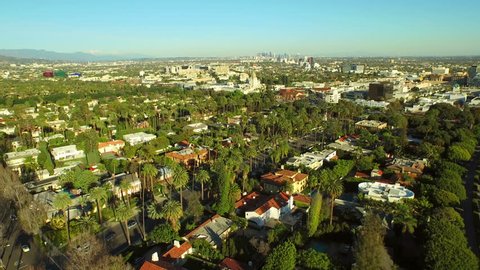 Los Angeles Aerial Beverly Hills v56 Low flying turning aerial over Beverly Hills neighborhood with 360 degree views.