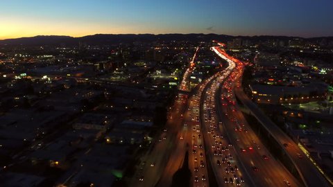 Los Angeles Aerial Freeway Dusk v71 Low flying aerial over interstate 405 at dusk with heavy traffic.