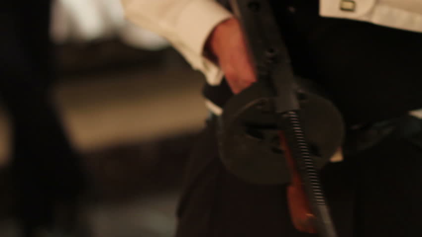 man with a tommy gun