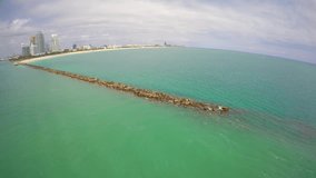 Aerial video of Miami Beach jetty with rocks at South Beach 4k