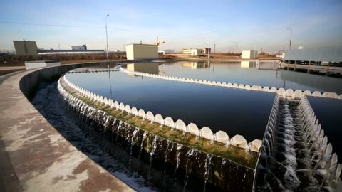 Sewage treatment plant - Waste water treatment (circular sedimentation tank). Purified water flows to the outlet and then to the river - outlet of treated sewage.