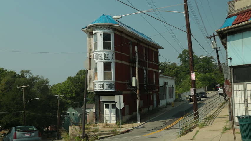 Free standing, characteristic corner house on hill in Cincinnati, USA.