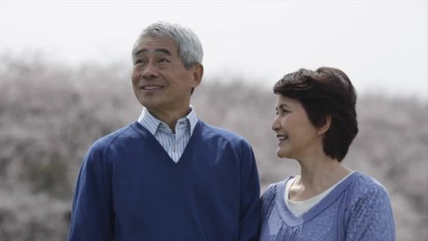 Smiling Japanese senior couple Stockvideó