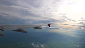 flying through clouds , Traveling by air. View through an airplane window, background texture for jet side window (1920x1080, HD, high definition 1080p) video, vdo