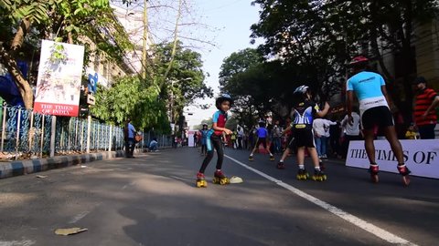 KOLKATA, WEST BENGAL / INDIA - MARCH 22ND : Unidentified city children rollerskating on blocked, otherwise busy,Park Street for "Happy Street" event, on 22.03.15. Children played, enjoyed and had fun.