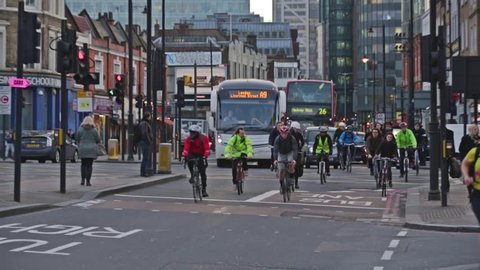 Shoreditch, London, UK, 25/03/2015 A busy road with London busses, Taxi's and cyclists 