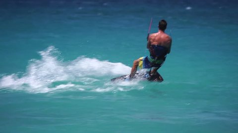 Extreme Sport Kite Boarding on the Ocean in Anguilla - Fit Athlete Performs Stunts in the Caribbean 